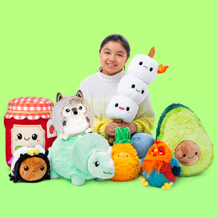 bright green background squishable branding photo generic group shot of model and plush